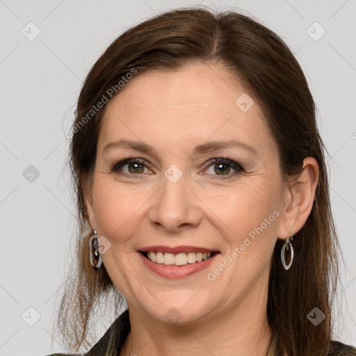 Joyful white adult female with medium  brown hair and grey eyes