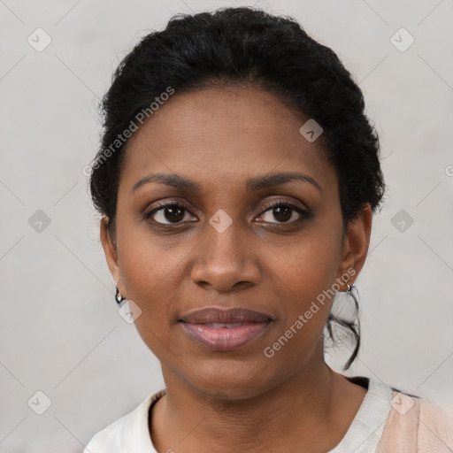 Joyful black young-adult female with short  brown hair and brown eyes