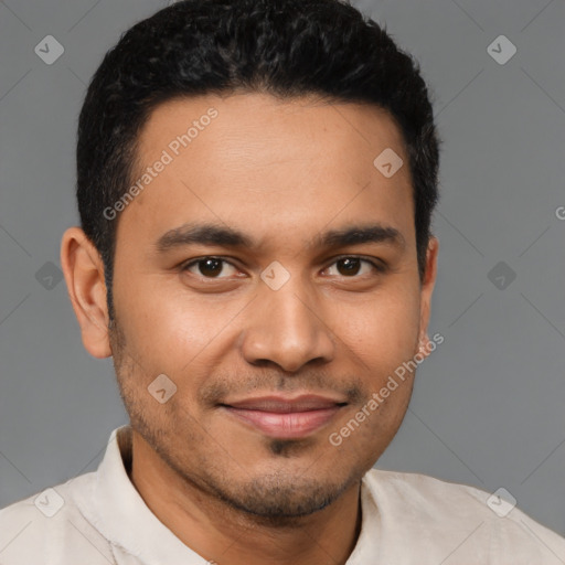 Joyful latino young-adult male with short  brown hair and brown eyes