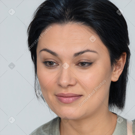 Joyful latino young-adult female with medium  brown hair and brown eyes