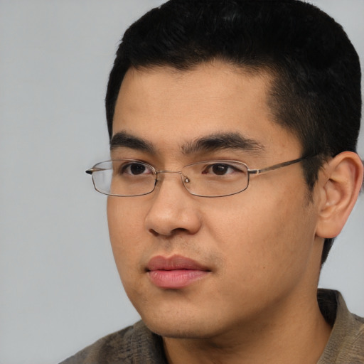 Neutral asian young-adult male with short  black hair and brown eyes