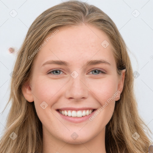 Joyful white young-adult female with long  brown hair and blue eyes