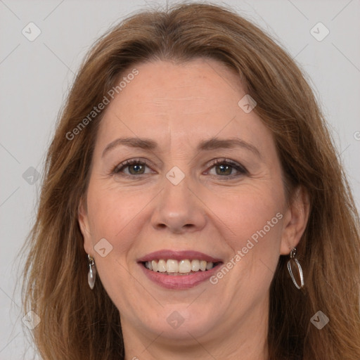 Joyful white adult female with long  brown hair and brown eyes