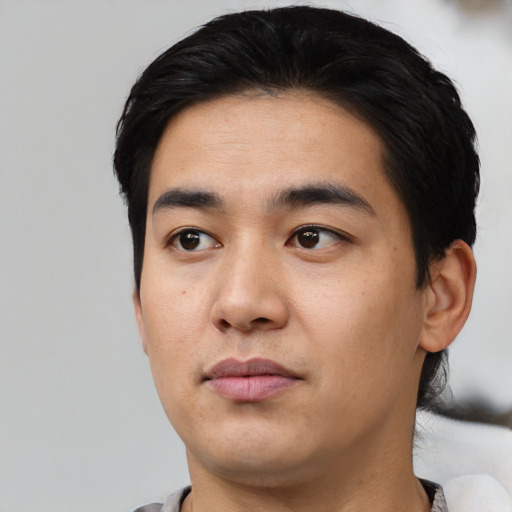 Neutral asian young-adult male with short  black hair and brown eyes