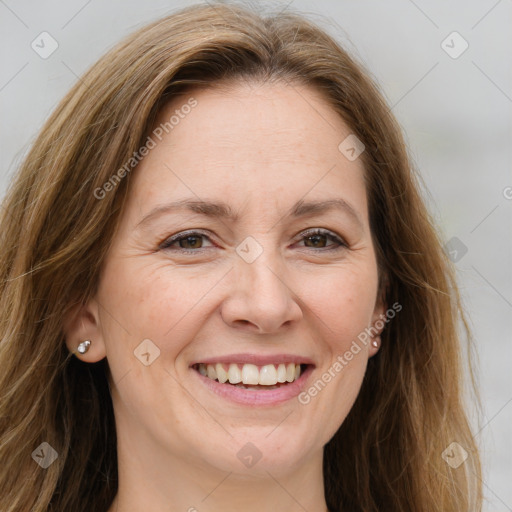 Joyful white adult female with long  brown hair and brown eyes