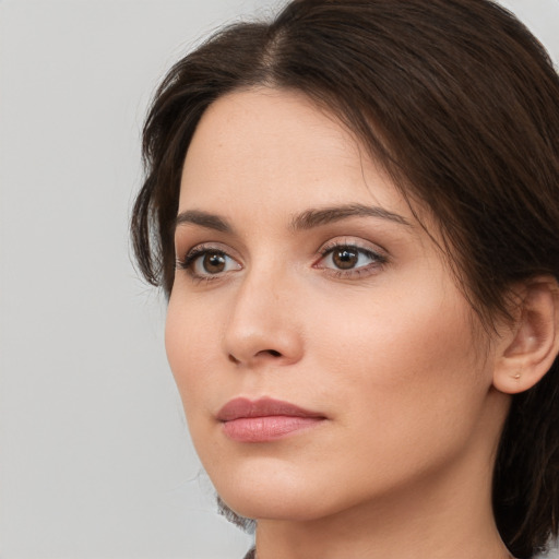 Neutral white young-adult female with medium  brown hair and brown eyes