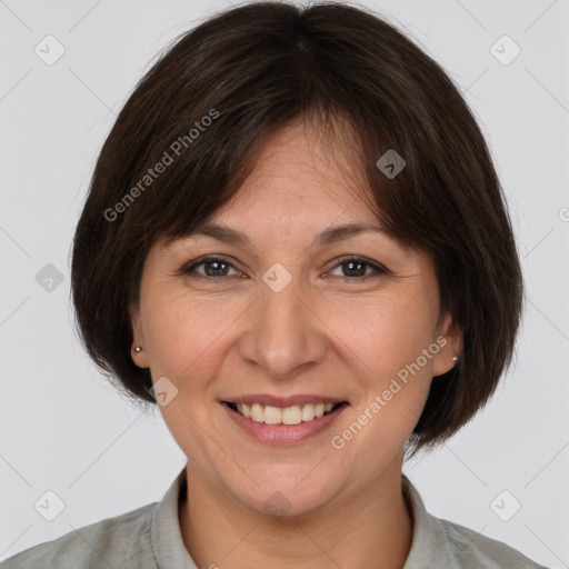 Joyful white adult female with medium  brown hair and brown eyes