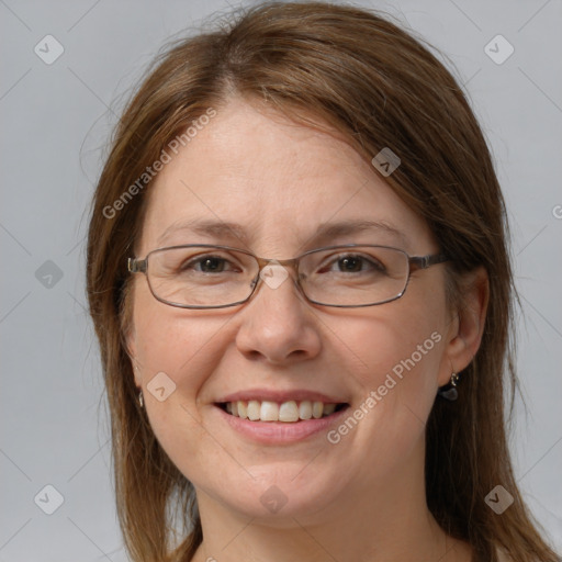 Joyful white adult female with medium  brown hair and grey eyes