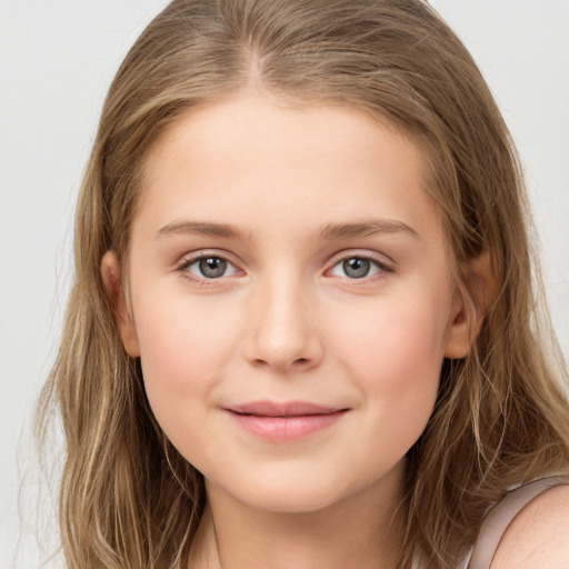 Joyful white child female with long  brown hair and brown eyes