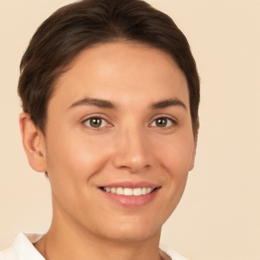 Joyful white young-adult female with short  brown hair and brown eyes