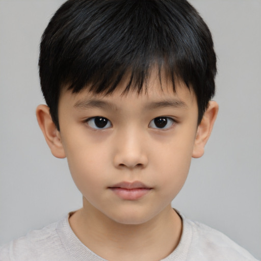 Neutral asian child male with short  brown hair and brown eyes