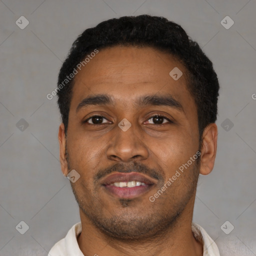 Joyful latino young-adult male with short  black hair and brown eyes