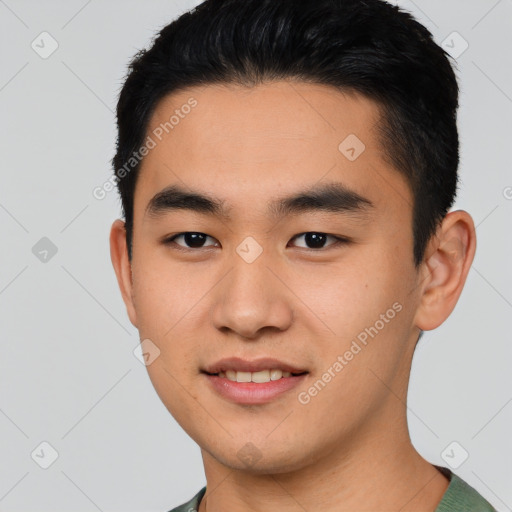 Joyful asian young-adult male with short  black hair and brown eyes