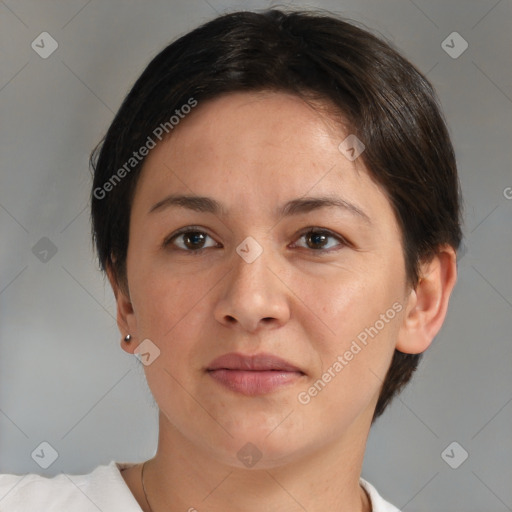 Joyful white adult female with short  brown hair and brown eyes