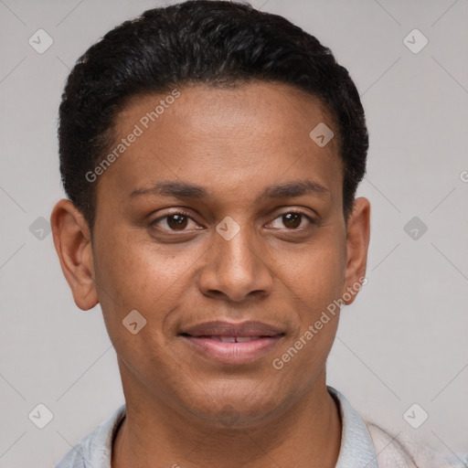 Joyful latino young-adult male with short  brown hair and brown eyes