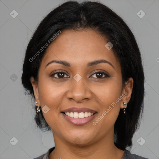 Joyful latino young-adult female with medium  brown hair and brown eyes