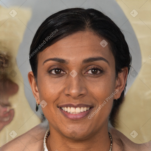 Joyful black young-adult female with medium  brown hair and brown eyes