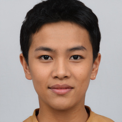 Joyful asian young-adult male with short  black hair and brown eyes