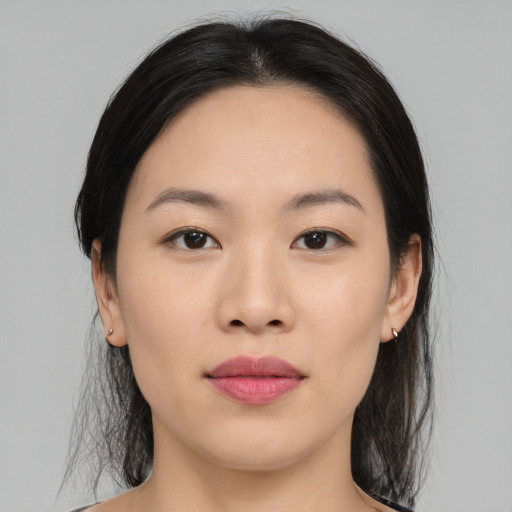Joyful white young-adult female with medium  black hair and brown eyes