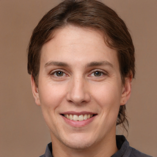 Joyful white adult female with short  brown hair and brown eyes