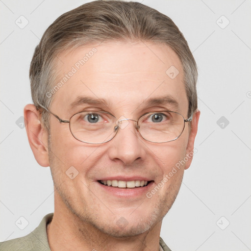 Joyful white adult male with short  brown hair and grey eyes