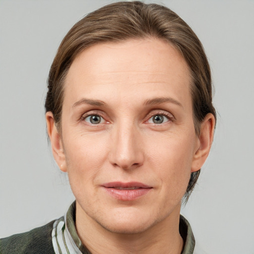 Joyful white adult female with short  brown hair and grey eyes