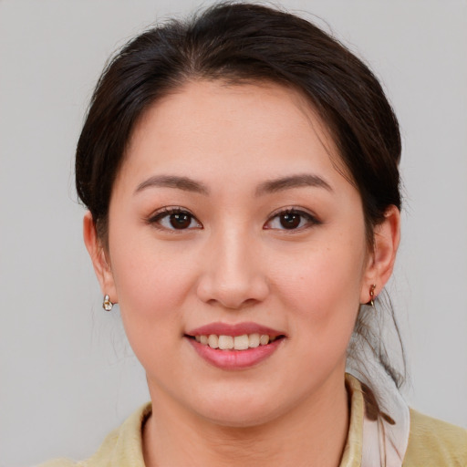 Joyful white young-adult female with medium  brown hair and brown eyes