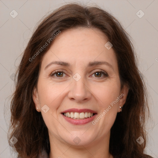 Joyful white adult female with medium  brown hair and brown eyes