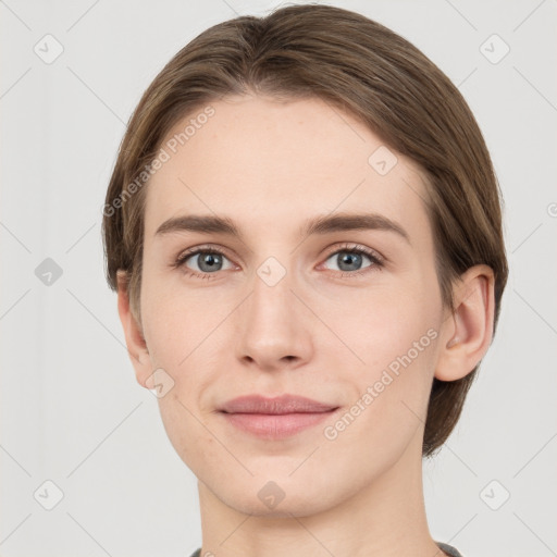 Joyful white young-adult female with short  brown hair and grey eyes