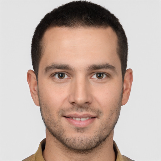 Joyful white young-adult male with short  brown hair and brown eyes