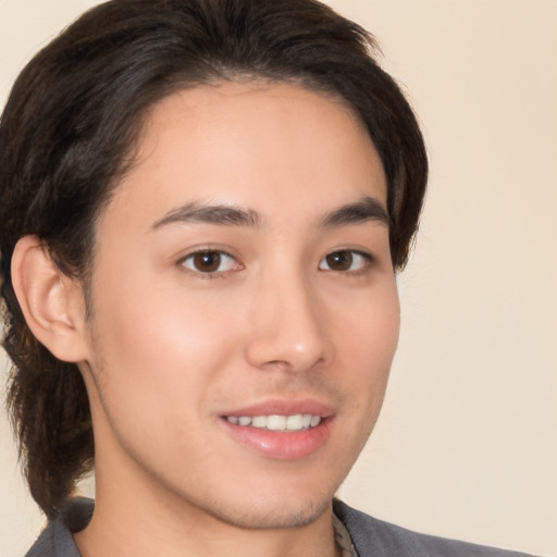 Joyful white young-adult male with medium  brown hair and brown eyes