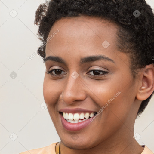 Joyful white young-adult female with short  brown hair and brown eyes