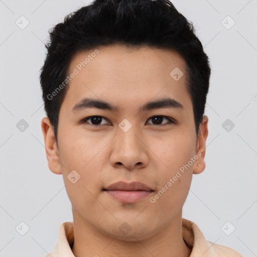 Joyful asian young-adult male with short  black hair and brown eyes