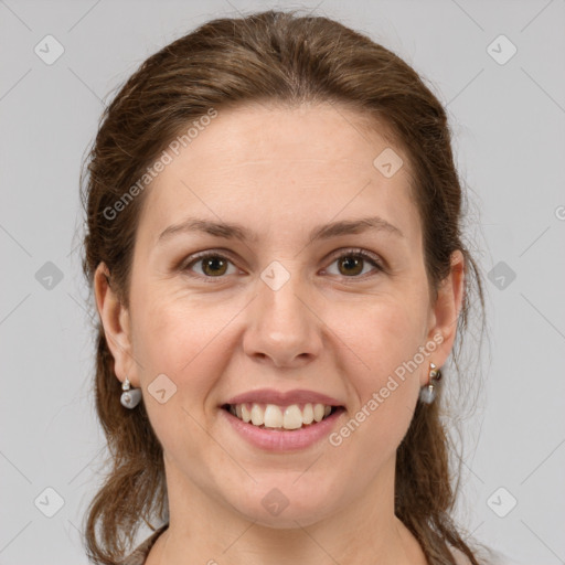 Joyful white adult female with medium  brown hair and grey eyes