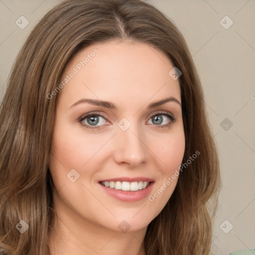 Joyful white young-adult female with long  brown hair and green eyes