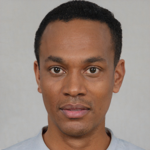 Neutral black young-adult male with short  black hair and brown eyes