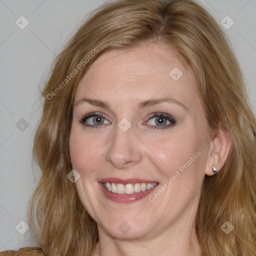 Joyful white adult female with medium  brown hair and blue eyes