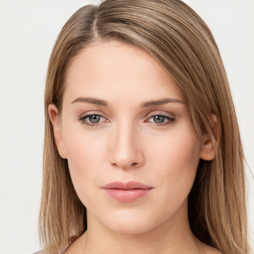 Neutral white young-adult female with long  brown hair and brown eyes