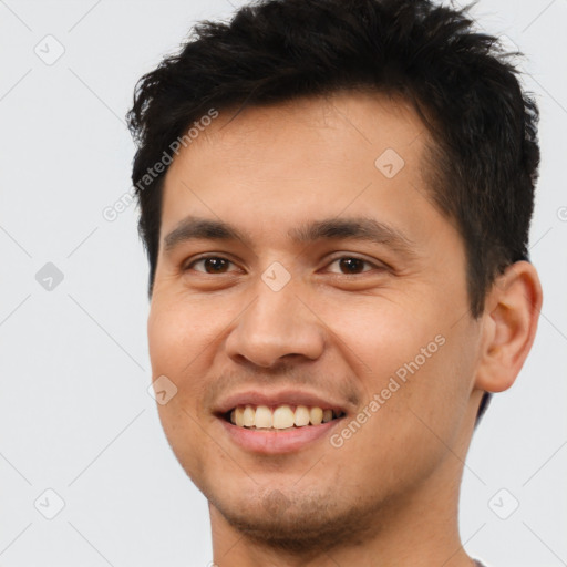 Joyful asian young-adult male with short  brown hair and brown eyes