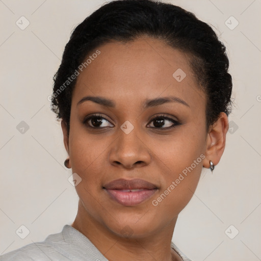 Joyful black young-adult female with short  brown hair and brown eyes