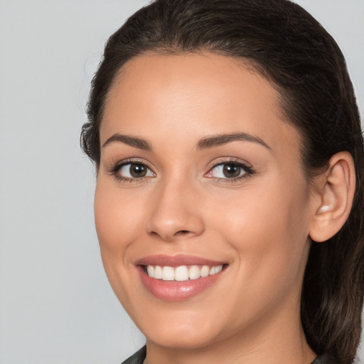 Joyful white young-adult female with medium  brown hair and brown eyes