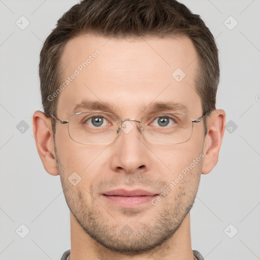 Joyful white adult male with short  brown hair and grey eyes