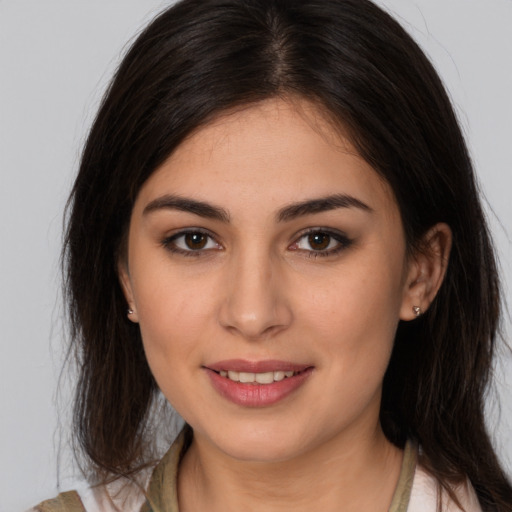 Joyful white young-adult female with medium  brown hair and brown eyes