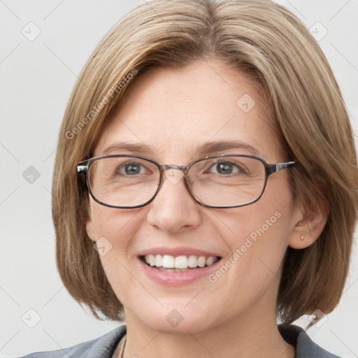 Joyful white adult female with medium  brown hair and blue eyes