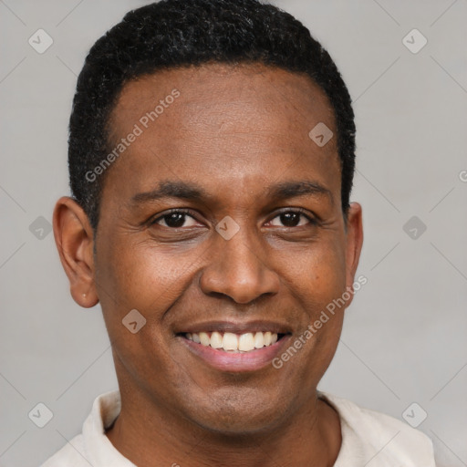 Joyful black young-adult male with short  brown hair and brown eyes