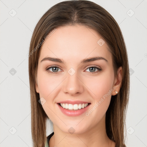 Joyful white young-adult female with long  brown hair and green eyes