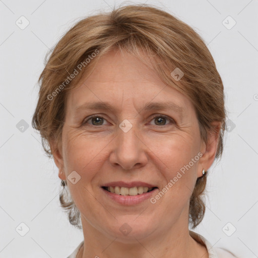 Joyful white adult female with medium  brown hair and grey eyes