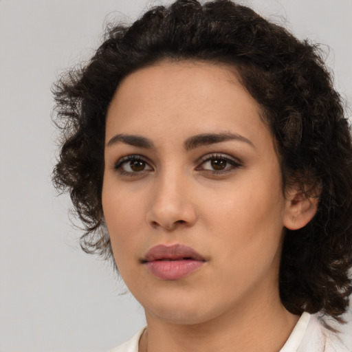Neutral latino young-adult female with medium  brown hair and brown eyes
