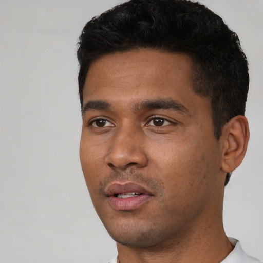 Neutral black young-adult male with short  black hair and brown eyes