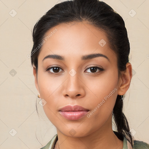 Joyful latino young-adult female with medium  black hair and brown eyes